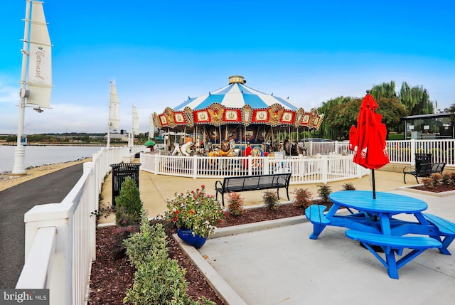 view of jungle gym with a water view