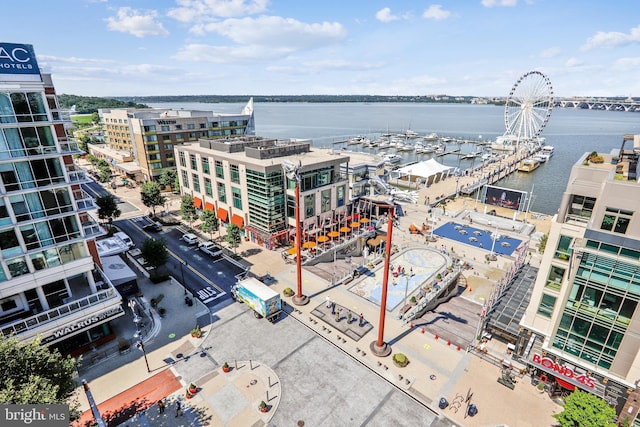 birds eye view of property with a water view