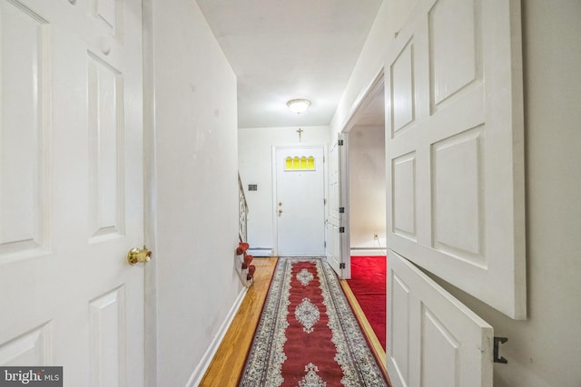 entryway featuring a baseboard radiator and hardwood / wood-style floors