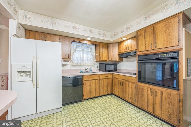 kitchen with black appliances and sink