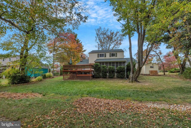 view of front of property with a garage, a front lawn, and a porch