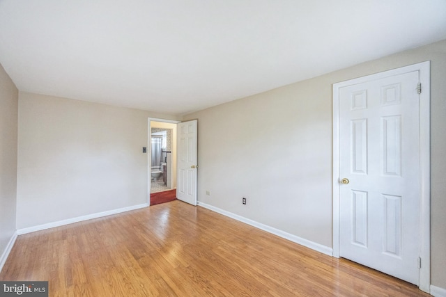 spare room featuring light hardwood / wood-style floors