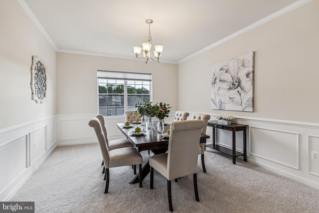 dining area with light carpet, an inviting chandelier, and ornamental molding