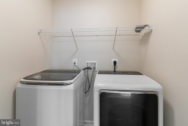 laundry area featuring washing machine and dryer