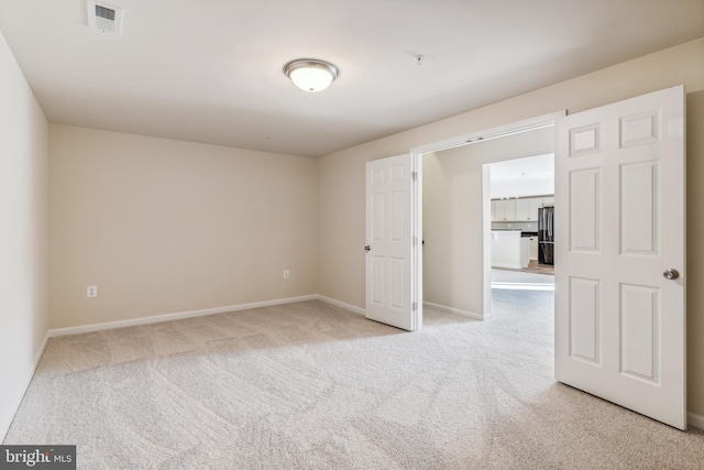 unfurnished room with carpet flooring