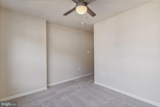 spare room with light carpet and ceiling fan