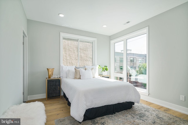 bedroom with light hardwood / wood-style flooring