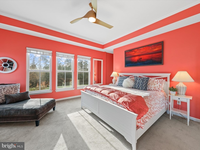 bedroom featuring ceiling fan, carpet floors, and ornamental molding