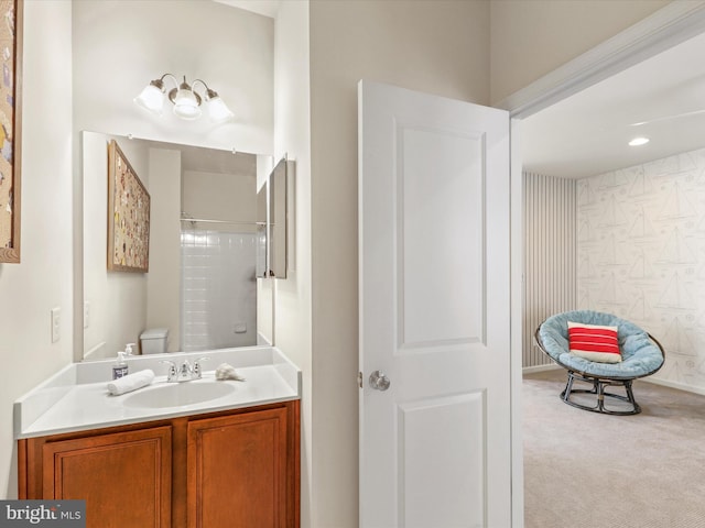 bathroom featuring walk in shower, vanity, and toilet