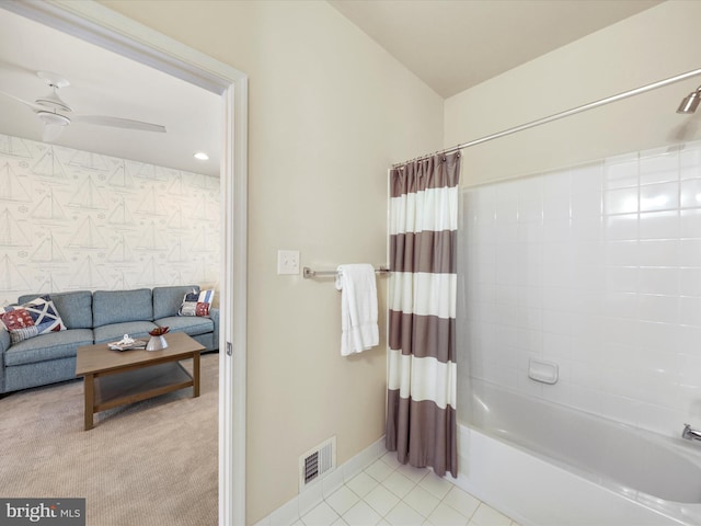 bathroom featuring tile patterned flooring, ceiling fan, and shower / bath combo with shower curtain