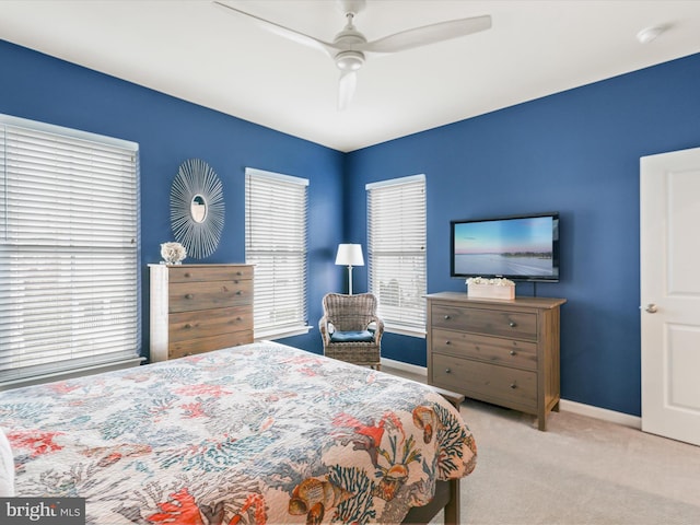 bedroom featuring ceiling fan and light colored carpet