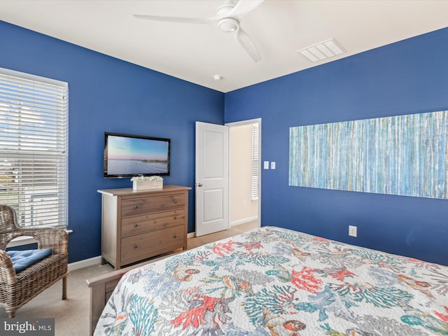 carpeted bedroom with ceiling fan