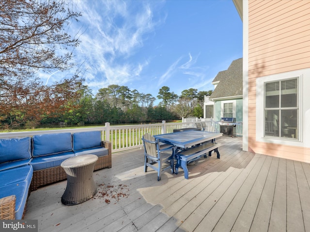 deck featuring area for grilling and an outdoor living space