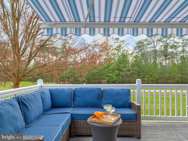 wooden terrace featuring an outdoor living space