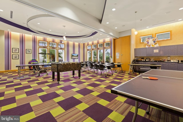 game room with dark colored carpet, a tray ceiling, and billiards