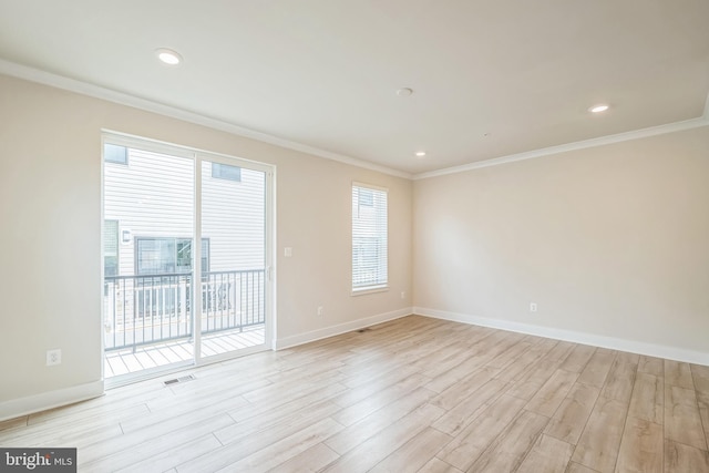 spare room with baseboards, visible vents, light wood-style floors, ornamental molding, and recessed lighting