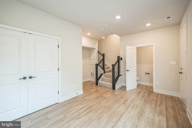 spare room with light wood-type flooring