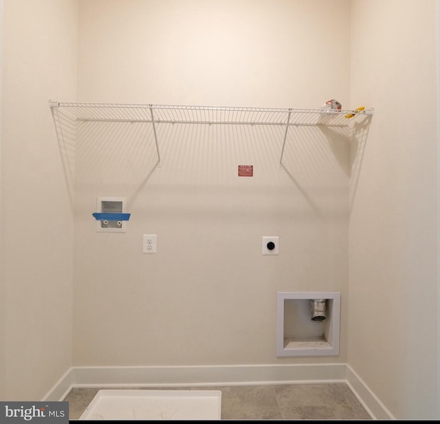 laundry room with washer hookup, baseboards, laundry area, and electric dryer hookup