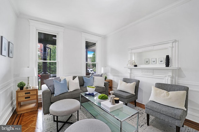 living room featuring crown molding and parquet floors