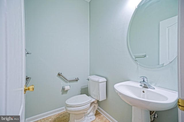 bathroom with tile patterned floors, sink, and toilet