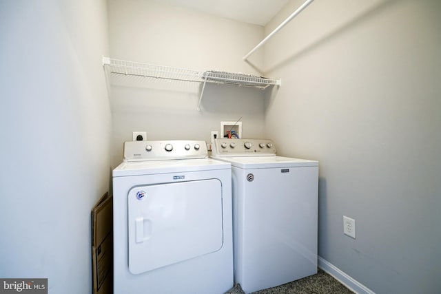 washroom featuring dark carpet and washing machine and dryer