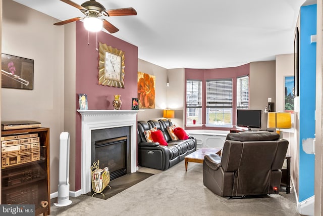 carpeted living room featuring ceiling fan