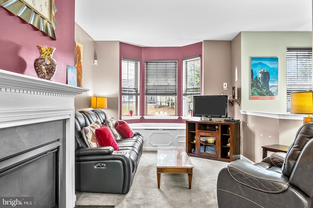 carpeted living room featuring a fireplace