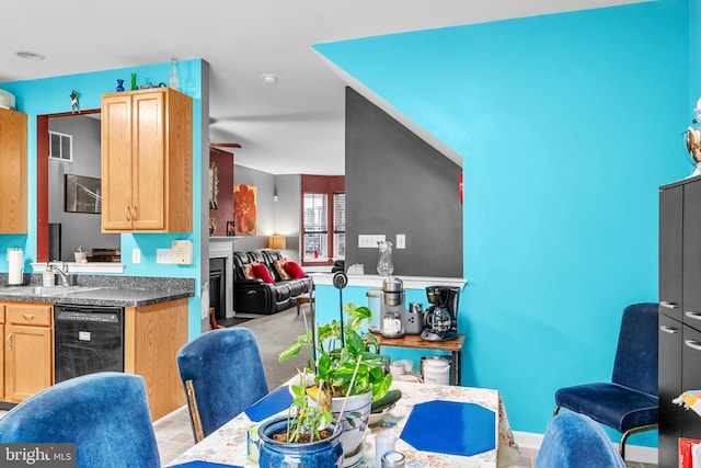 kitchen featuring light brown cabinets, dishwasher, ceiling fan, and sink