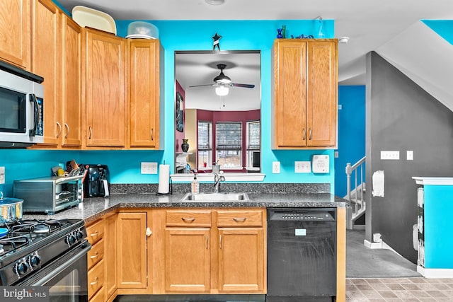 kitchen featuring ceiling fan, stainless steel appliances, and sink