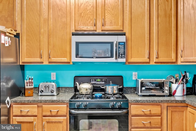 kitchen with appliances with stainless steel finishes