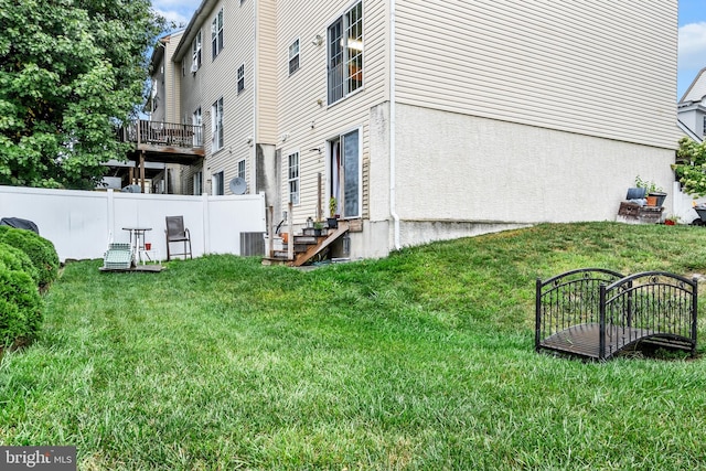 view of yard with central air condition unit