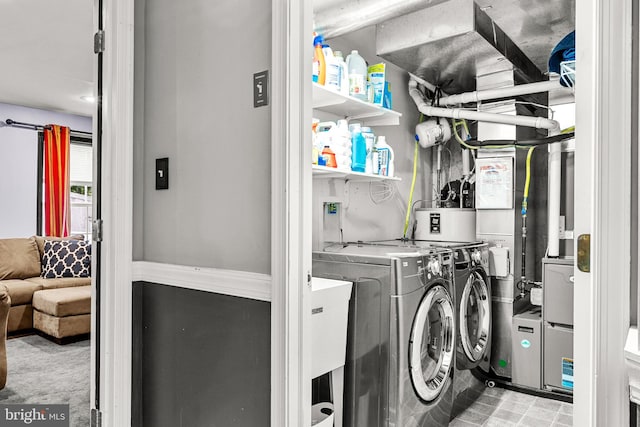 washroom featuring washer and clothes dryer