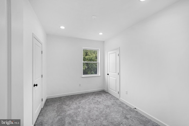 empty room featuring light carpet