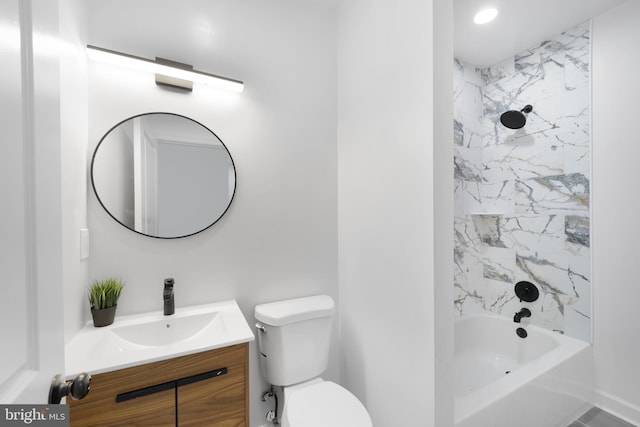 full bathroom with tiled shower / bath combo, vanity, and toilet