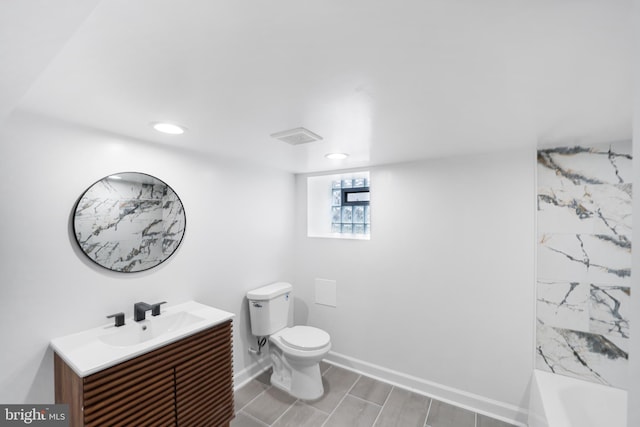 full bathroom featuring vanity, toilet, and separate shower and tub