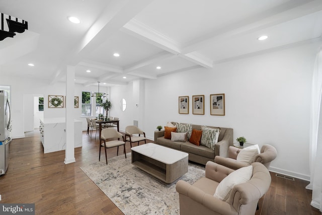 living room featuring coffered ceiling, beam ceiling, and dark hardwood / wood-style flooring