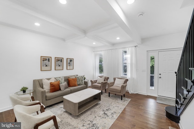 living room featuring beamed ceiling and hardwood / wood-style floors