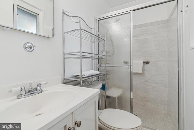 bathroom with walk in shower, vanity, crown molding, and toilet