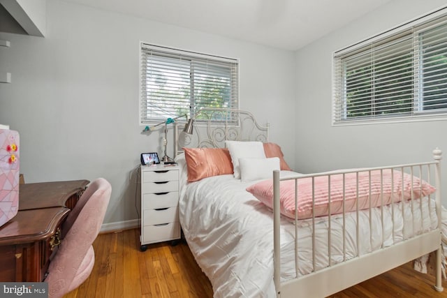 bedroom with light hardwood / wood-style floors