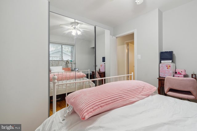 bedroom featuring wood-type flooring and ceiling fan