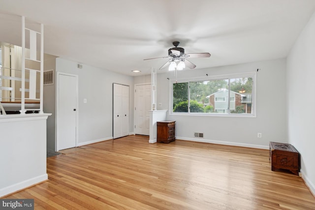 unfurnished living room with ceiling fan and light hardwood / wood-style floors