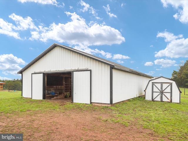 view of outbuilding with a lawn