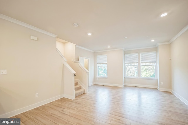 interior space featuring light hardwood / wood-style floors and ornamental molding