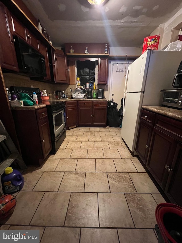 kitchen featuring white fridge and electric stove