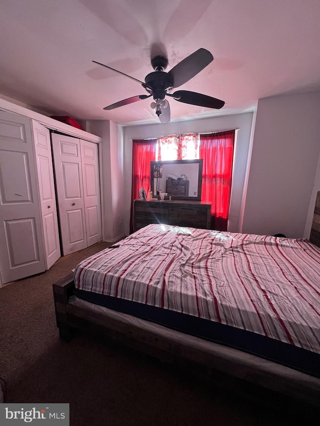 unfurnished bedroom featuring a closet, ceiling fan, and carpet