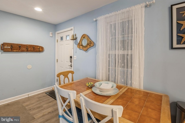 dining room with hardwood / wood-style floors