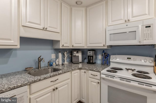 kitchen featuring sink, white appliances, and white cabinets