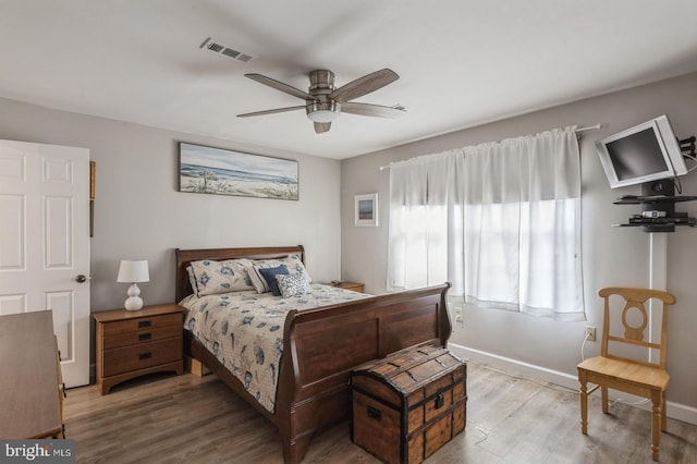 bedroom featuring hardwood / wood-style flooring and ceiling fan