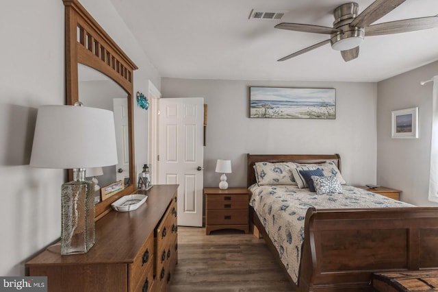 bedroom featuring dark hardwood / wood-style floors and ceiling fan