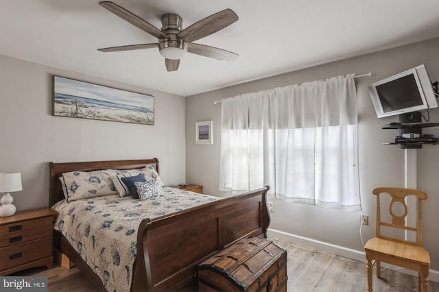 bedroom with ceiling fan and light hardwood / wood-style floors